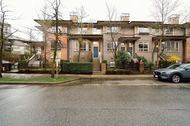 View of front facade with fence and a chimney | Image 37