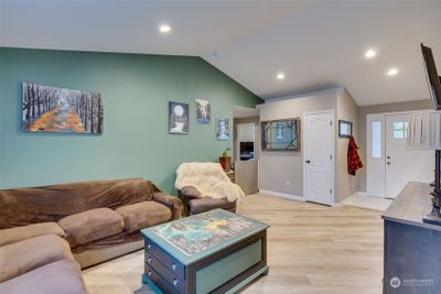 looking back towards front door and access to bedrooms/bathrooms on through doorway in middle of photo | Image 3