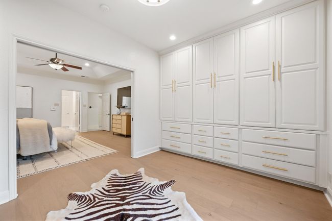 Bedroom with light wood finished floors and recessed lighting | Image 15