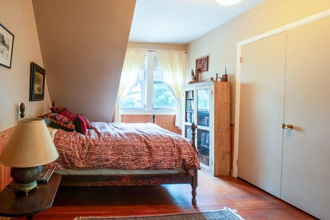 Bedroom with hardwood / wood-style floors | Image 14