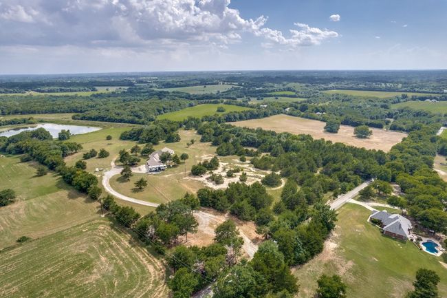View of rural area with a nearby body of water | Image 23