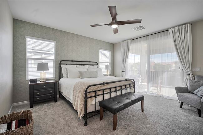 Carpeted bedroom featuring ceiling fan and visible vents | Image 16
