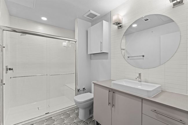 Full bath with toilet, tile walls, vanity, a shower stall, and tasteful backsplash | Image 13