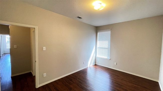Unfurnished room featuring wood finished floors and baseboards | Image 25