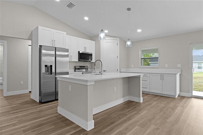 Kitchen with corner pantry and island | Image 6