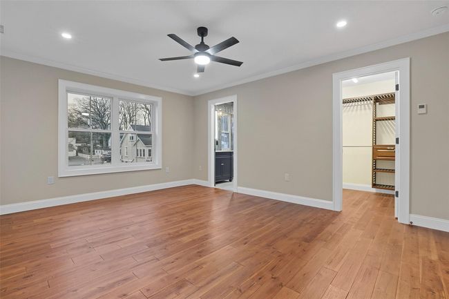 Primary bedroom includes private bath and large walk-in closet. | Image 23
