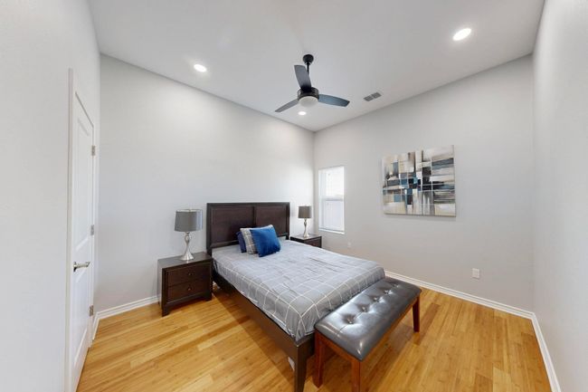 Bedroom featuring baseboards, light wood finished floors, recessed lighting, and a ceiling fan | Image 13