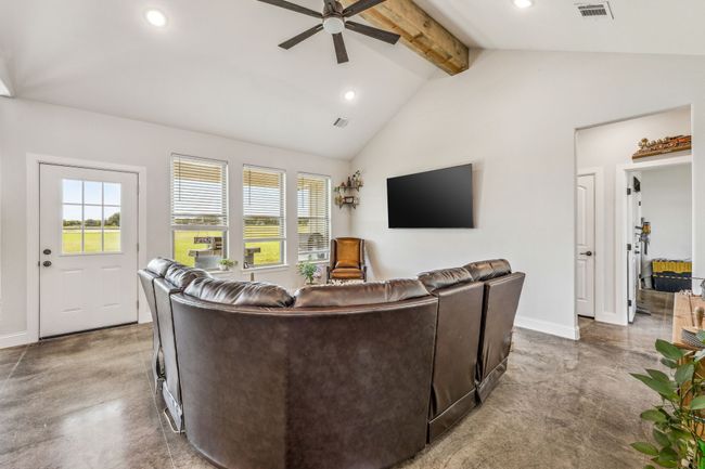 Living area with a ceiling fan, healthy amount of natural light, recessed lighting, and baseboards | Image 4