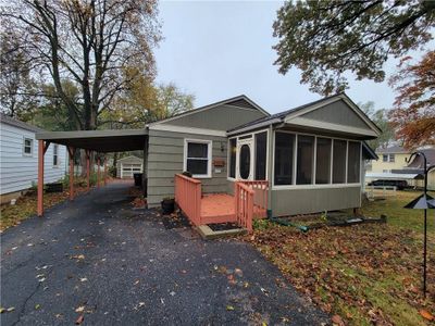 large driveway, double length carport and 1 car garage | Image 3