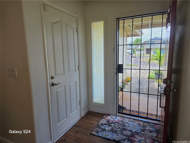 New front, security screen door and garage to entry door | Image 10