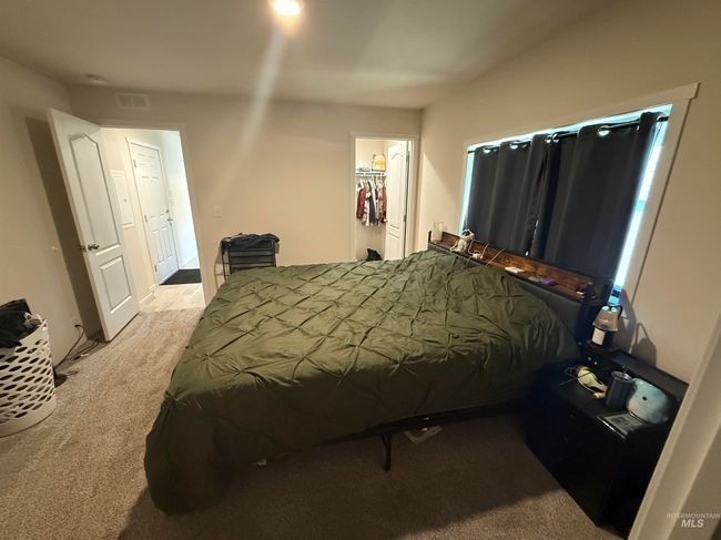 Bedroom featuring light carpet | Image 10