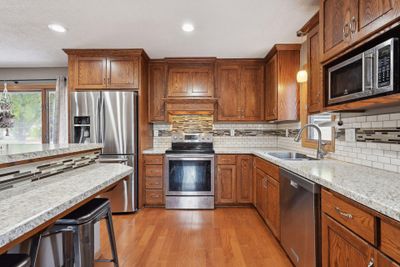 Stunning updated kitchen with abundant countertop space and storage. | Image 2