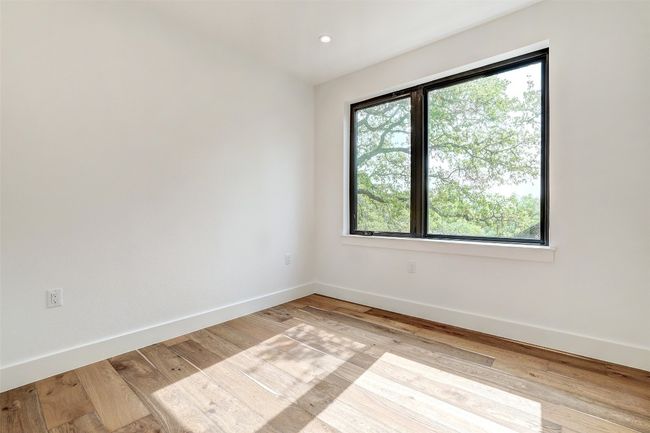 Empty room featuring light wood-style floors and recessed lighting | Image 20
