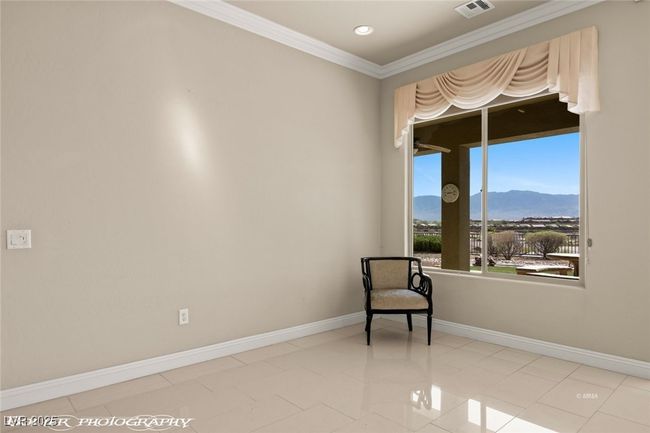 Sitting room with baseboards, a mountain view, ornamental molding, recessed lighting, and visible vents | Image 25