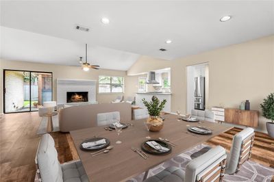 Spacious open living, dining and kitchen with vaulted ceilings and tons of natural light that floods in from 3 sides. | Image 3