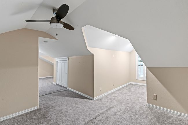 Bonus room featuring vaulted ceiling, carpet, ceiling fan, and baseboards | Image 28
