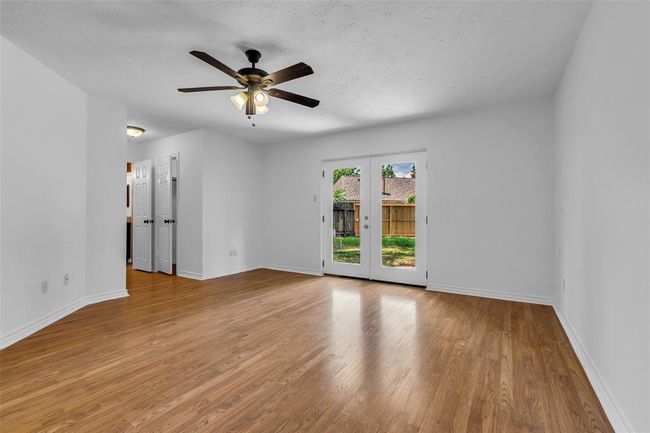 There is a his and hers closet on each side of the hallway to the bathroom. | Image 23