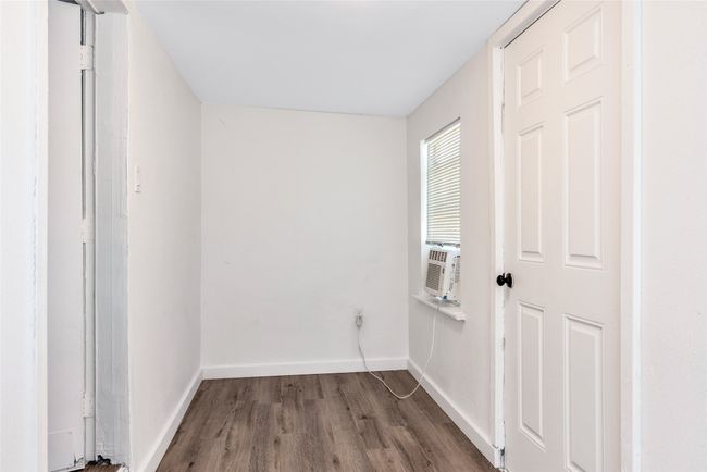 Spare room with wood finished floors and cooling unit | Image 27