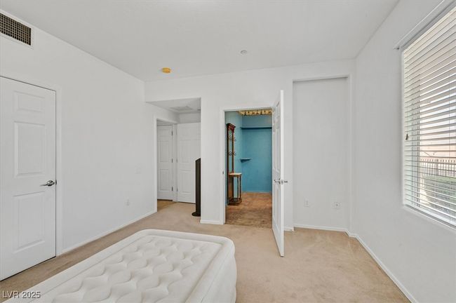 Bedroom with light colored carpet and baseboards | Image 11