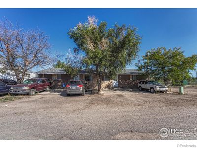 Units 122 & 124. Lots of off street parking and mature trees. | Image 2