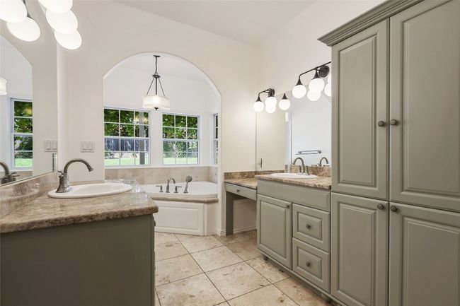 Bathroom featuring vanity, a garden tub, and tile patterned floors | Image 8