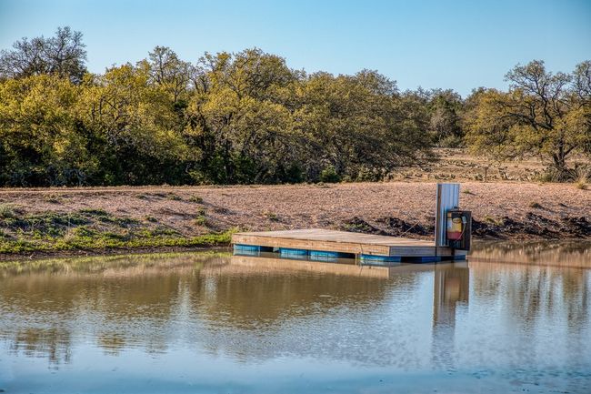Dock area featuring a water view | Image 26