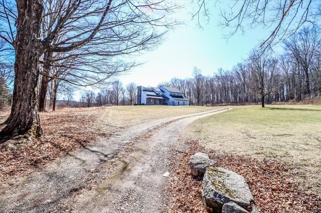 A meandering gravel driveway leads you home! | Image 39