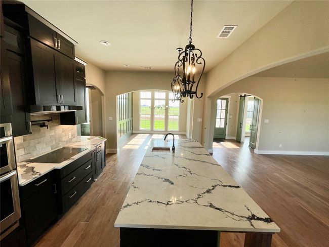 Chefs kitchen with vegetable sink in the large quartz island | Image 7