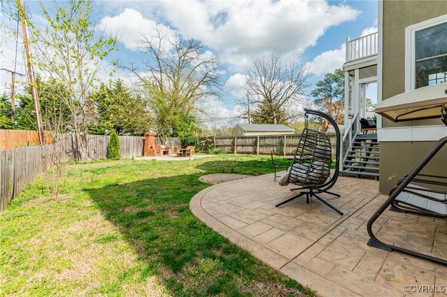 View of yard with a fenced backyard, a patio area, and stairway | Image 44