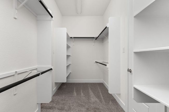 Walk in closet featuring carpet flooring | Image 23