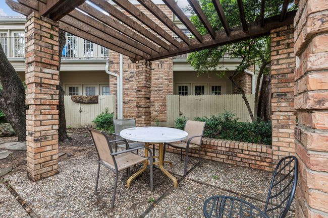 View of patio with a pergola and outdoor dining space | Image 31