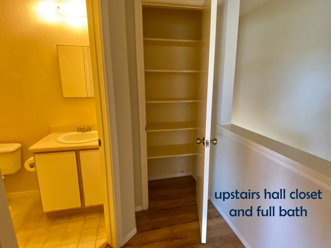 Upstairs hall closet and bathroom | Image 12