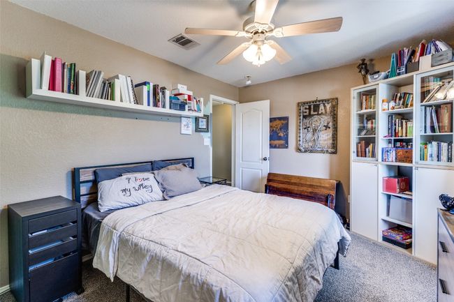 Carpeted bedroom with ceiling fan | Image 27