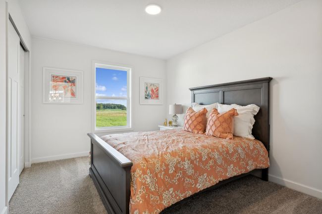 (Photo of a decorated model, actual homes finishes will vary) The primary bedroom walk-in closet. | Image 13