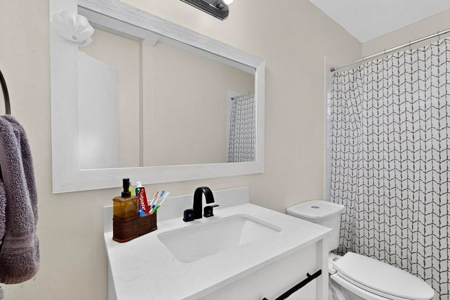 Full bathroom featuring vanity and a shower with curtain | Image 10