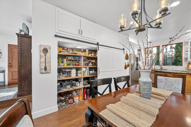 Behind the barn door is a large pantry | Image 18
