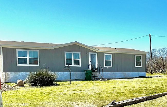 View of front facade featuring a front lawn | Image 13