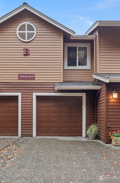 The attached garage is connected directly to the interior of the home. Driveway parking is allowed, so there are 2 dedicated spots, plus ample guest parking. | Image 1