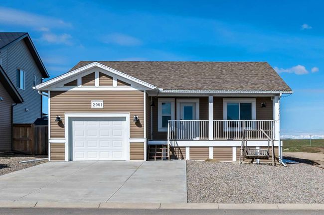2001 31 Avenue, Home with 4 bedrooms, 2 bathrooms and 2 parking in Nanton AB | Image 1