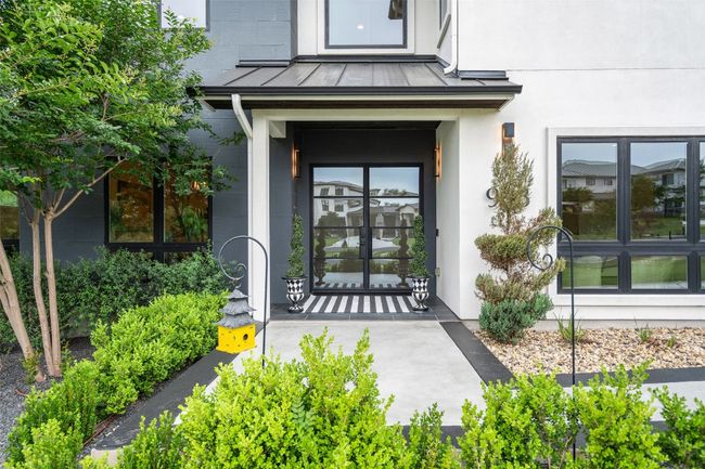 Step into timeless sophistication through this beautifully designed entry. | Image 11