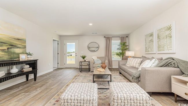 Living room with light hardwood / wood-style flooring | Image 11