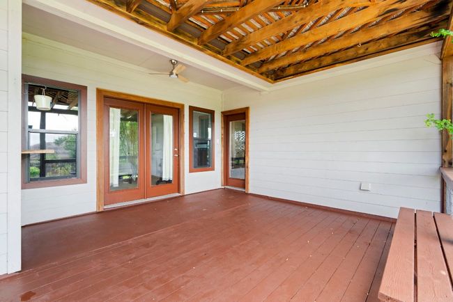 A shaded outdoor retreat with room to grill, chill, or host the whole crew. | Image 25