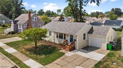 View of front of property with a garage and a front lawn | Image 2