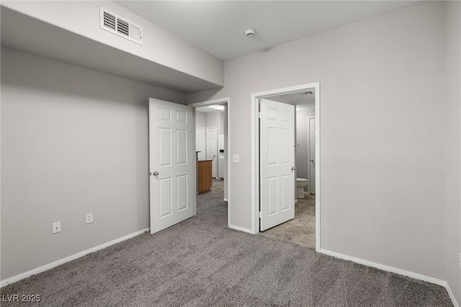 Unfurnished bedroom with carpet flooring, visible vents, and baseboards | Image 23