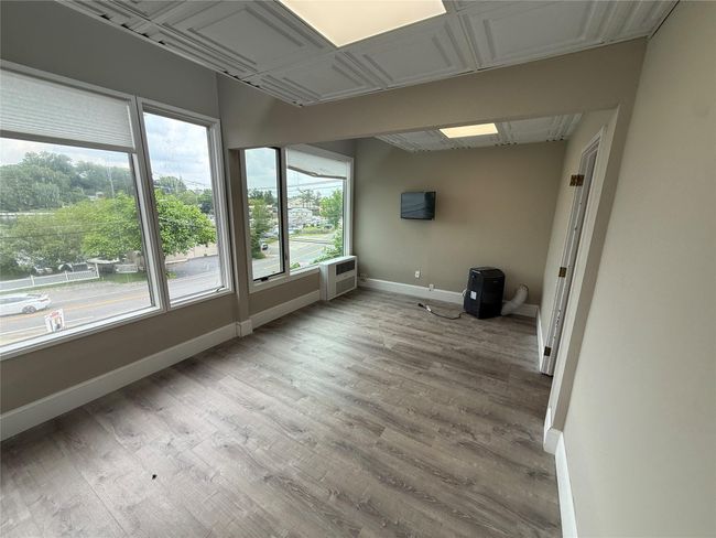 View of unfurnished sunroom | Image 5
