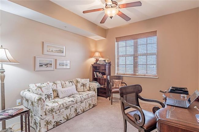 Carpeted office featuring ceiling fan | Image 36