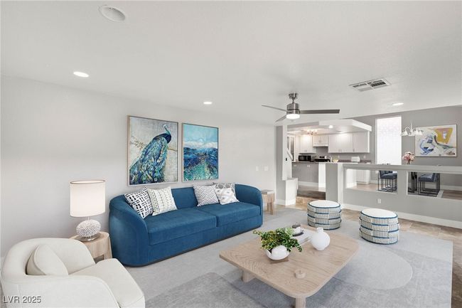 Living room with recessed lighting, visible vents, light tile patterned floors, baseboards, and ceiling fan | Image 16
