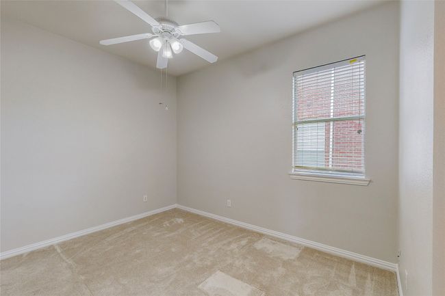 Spare room with light carpet, ceiling fan, and baseboards | Image 36