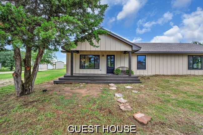 View of front of attached Guest house with a lovely front porch | Image 33