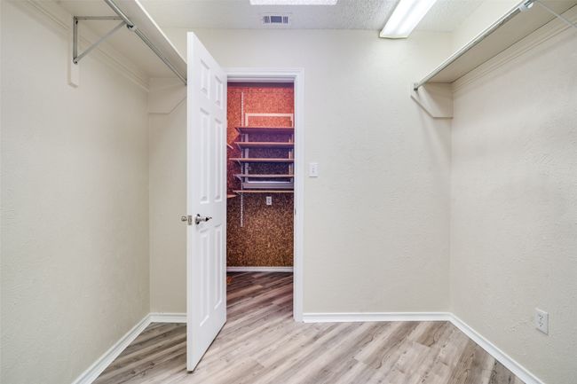 Spacious closet with visible vents and light wood finished floors | Image 28
